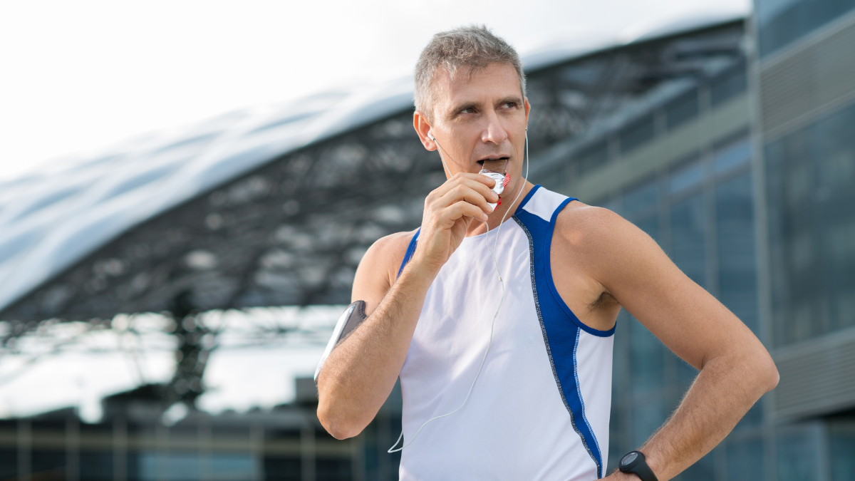 Man eating supplement that won't cause runner's gut or digestive issues